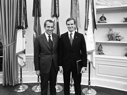 President Nixon with Staff Assistant Gordon C. Strachan in the Oval Office around 1971