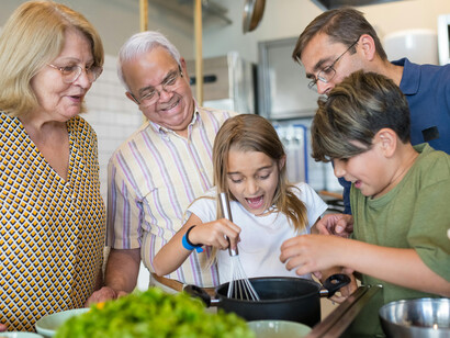 A family preparing a meal together in the kitchen