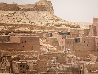 The ancient kasbah of Aït Benhaddou overlooking the surrounding settlement, representing the resilience of Morocco's foundations