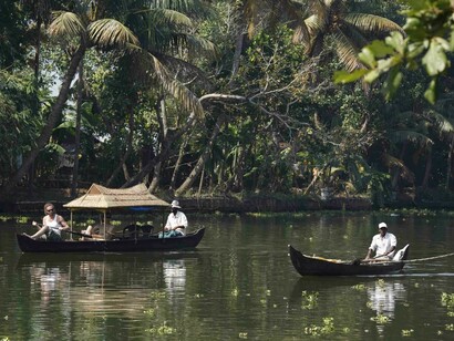 Country-made boats gliding in the Sparkling Lake waters