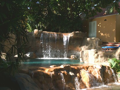 The lush greenery and inviting pool reflect the charm that guests experience within this UNESCO World Heritage village complex of restored buildings