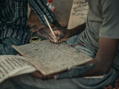 Almajiri boys receiving education typically in Quranic schools, where they learn religious studies alongside basic literacy, Nigeria