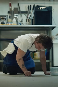 Jeremy Allen White as Carmen ''Carmy'' Berzatto from The Bear cleaning the floor