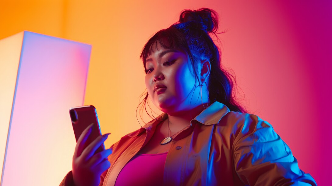 A young women interacting with her TikTok app for entertainment and information