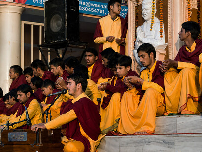 Young Vedic students taking part in the Ganga Aarti ceremony at Parmarth Niketan Ashram in Rishikesh