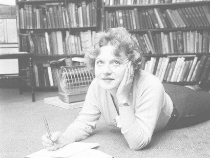 Muriel Spark lying down and thinking of her next phenomenal piece of literary art 