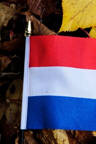 The flag of the Netherlands along with its iconic cultural footwear the clog
