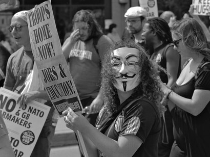 Demonstrators rally against NATO, voicing opposition in a public march
