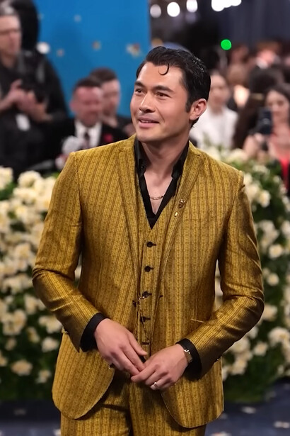 Henry Golding in Ozwald Boateng, wearing a gold three-piece tailored suit inspired by Black dandyism during the 2025 Met Gala