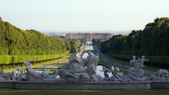 The Royal Palace of Caserta seen from the fountain of Venus and Adonis inside the Royal Park, Italy