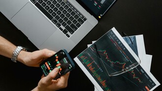 Man navigates investment options on his phone