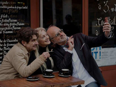 The warmth of a family-run bistro as patrons enjoy drinks in a cozy setting