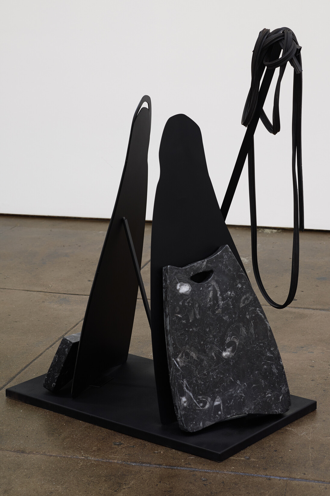 Rallou Panagiotou, Rubber Lineage II, 2014, black marble, steel, spray paint, rubber, 80 x 70 x 38 cm, Courtesy the artist and Ibid London & Los Angeles
