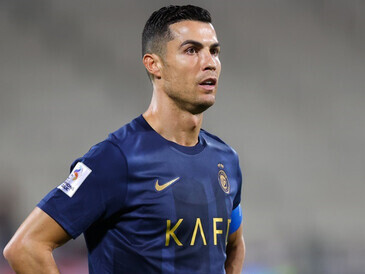 The Al-Nassr fans fill the King Fahd Stadium in Saudi Arabia, creating an electric atmosphere with their passionate support