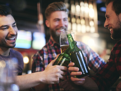 Friends making a toast at a bar