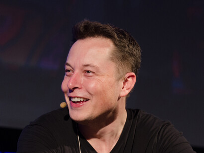 Musk smiling at an interview