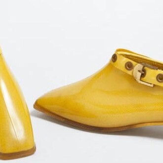 Yellow ankle boots in Polyvinyl chloride (PVC) lined with cotton jersey, Mary Quant, 1967, London. Museum no. T.591: 1&2-1992. © Victoria and Albert Museum, London