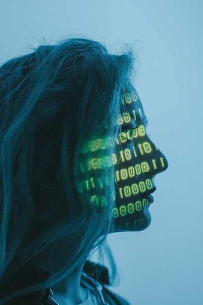 Woman with coding projected onto her