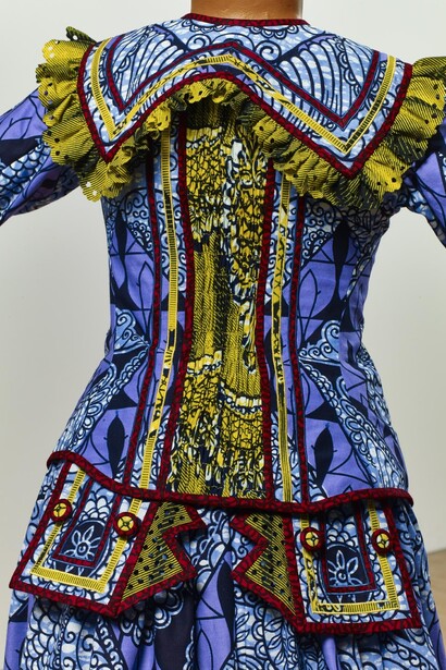Yinka Shonibare MBE b. 1962, Girl Balancing Knowledge (2015)
Fibreglass mannequin, Dutch wax printed cotton textile, books, globe and steel baseplate
179 x 139 x 89 cm (70 1/2 x 54 3/4 x 35 in.)
Photographer: Stephen White
Image courtesy the artist, Stephen Friedman Gallery,
London and Pearl Lam Galleries, Hong Kong, Shanghai
and Singapore. Detail
