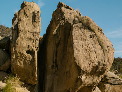 Brown rock formation under blue sky
