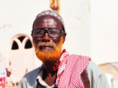 The elder’s wise gaze is a silent reflection of the cultural importance of proverbs in Somali life, where each wrinkle on the face speaks volumes about shared wisdom