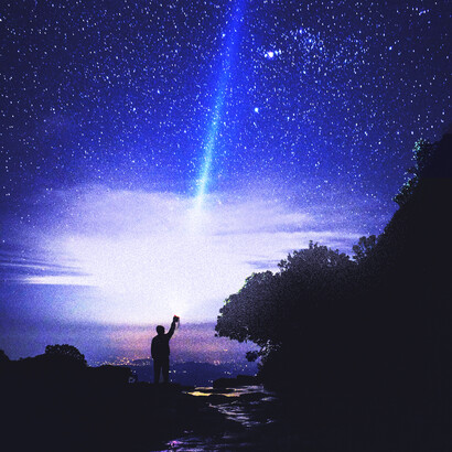 A tourist enjoying the night sky