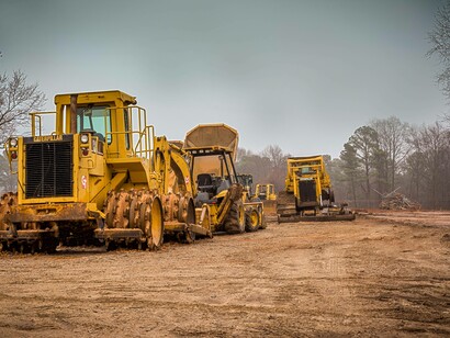 Bulldozers and tractors digging for uranium in a uranium mine