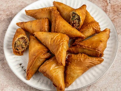 Briouates, a typical Morrocan dessert, which are triangle-shaped and can be either salty, or sweet and filled with cinnamon, flower water, sugar, and almonds