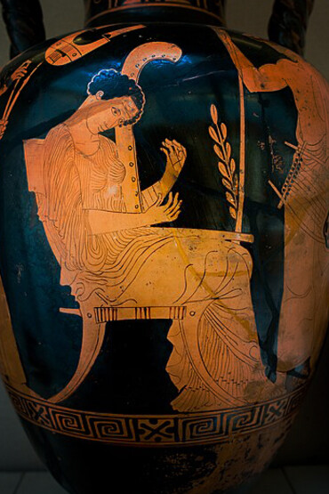 Terpsichore, seated in a chair, playing the harp (magadis), while Mousaios stands beside her, adorned with a laurel wreath in his hair, holding a lyra (chelys) and a long staff adorned with laurel leaves, London, British Museum, UK