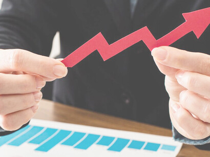 A businessman holding a growth arrow, symbolizing career goals, targets, and work-life balance