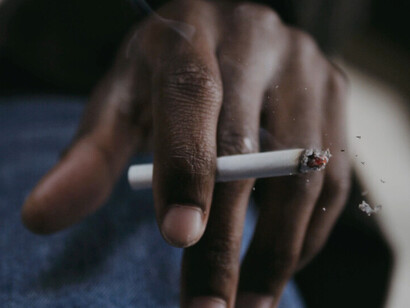 The glowing ember serves as a stark reminder of the addictive grip nicotine holds on many, particularly the youth
