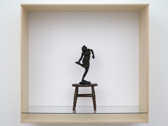Haim Steinbach, dancer with raised right foot, 2011, Wood, plastic laminate and glass box; wood stool; painted bonded bronze Degas statuette, 52 x 56 x 25 5/8 inches; 132.1 x 142.2 x 65.1 cm. Collection Statens Museum fur Kunst, Copenhagen. Courtesy the artist and Tanya Bonakdar Gallery, New York
