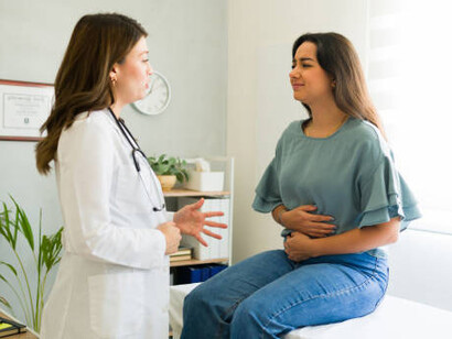 Portrait of a doctor performing a mammography examination with an X-ray scanner in a clinical setting
