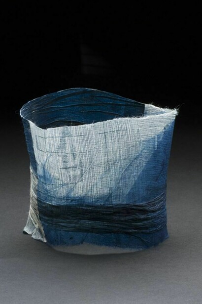 Yuko Kimura (American, b. 1968), Indigo Shiwa Shiwa (wrinkle wrinkle) no. 3, 2013, indigo dye and intaglio on pleated, washi & old book pages from Japan, 3 1/8 x 3 1/2 x 3 1/2 inches