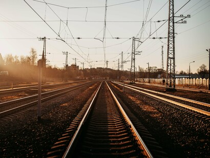 Electrified rail lines extending into the distance, symbolising the foundations of Europe's defence and economic connectivity