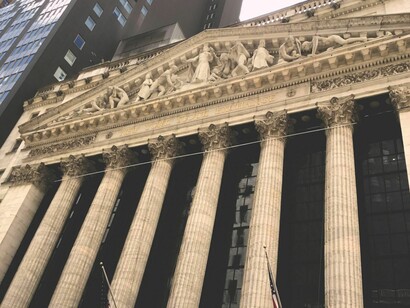Capitalist systems operate on an amoral premise of endless growth and unregulated wealth accumulation, an environment that inherently deforms democracies and destroys community equality. New York Stock Exchange Broad Street facade