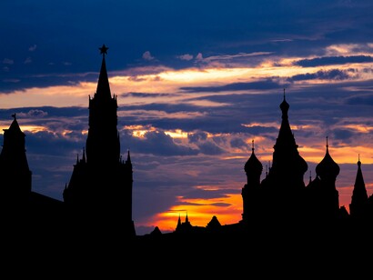 The Kremlin's towers against the evening sky, representing centuries of authority rooted in history and tradition