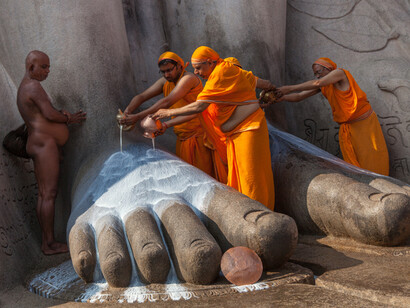 Prayers being performed at Lord Bahubali or Gomateshwara Statute