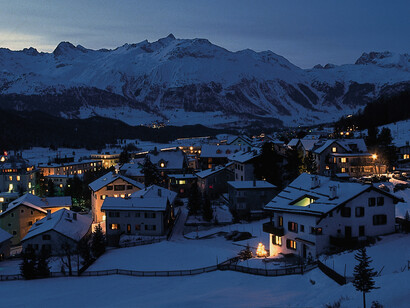 The village of Pontresina in winter, at dusk