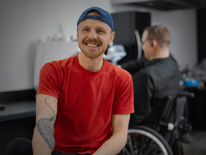 People using wheelchairs working in a coffee shop, highlighting disability inclusion in the workplace