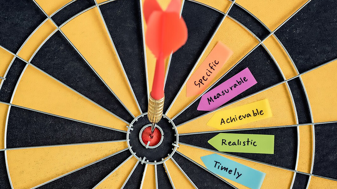 SMART goals focused on a dartboard target, emphasizing clarity and precision in goal-setting