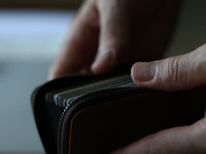The hollow sight of an empty wallet, a stark representation of the living cost crisis gripping many