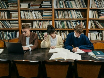 Young researchers combining digital tools with traditional mediums, reflecting the evolving relationship between technology and learning