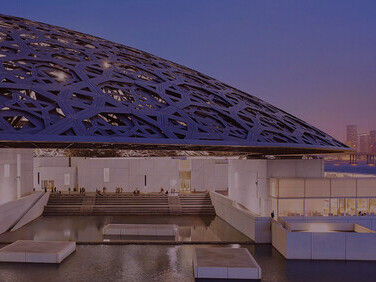 Experience the awe-inspiring view beneath the iconic dome of Louvre Abu Dhabi, a testament to architectural brilliance and cultural richness
