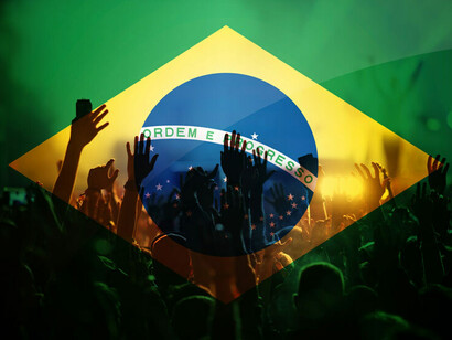 Brazilian flag and football fans, Brazil. Pelé's family are Brazilians