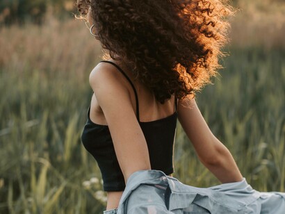 A woman liberating herself by shedding cloth