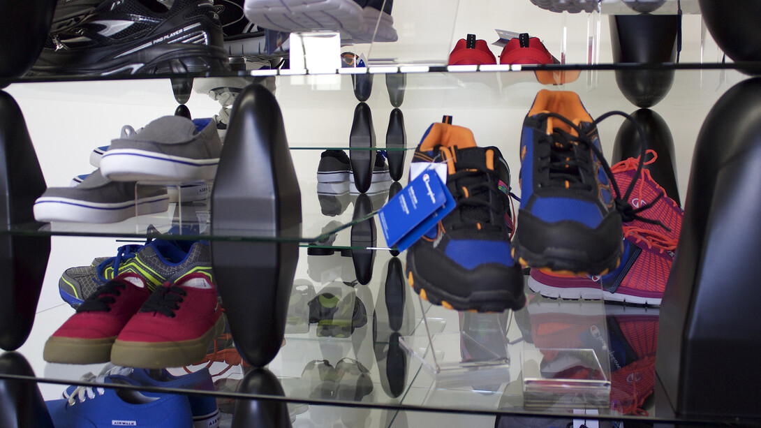 Patrick Jackson, Shelving Unit, 2015, Glass, shoes, plastic, 36 x 67 ½ x 36 in. Courtesy Galerie GP & N Vallois, Paris
