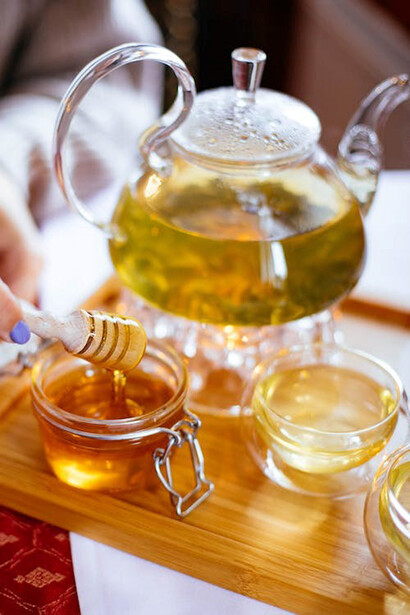 Clear glass cup filled with honey
