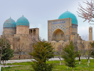 Kok-Gumbaz mosque, mausoleums and madrasa. The Kok-Gumbaz mosque (blue dome) is seen from the front in the background; it dates from 1435–1436, Shahrisabz, Uzbekistan