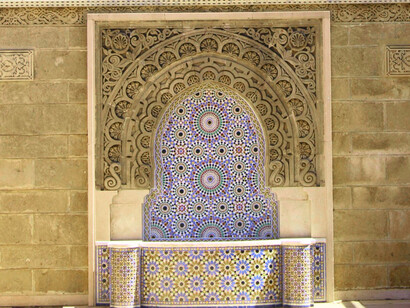 A public fountain with blue-and-white tiles, showing how Rabat, Morocco ties in its heritage into their public space